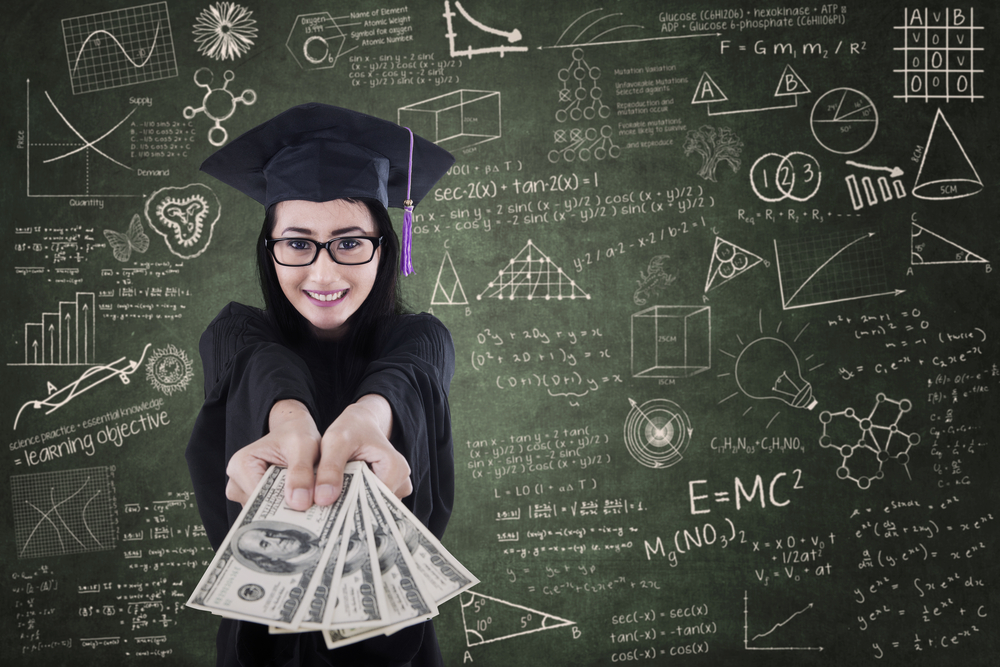 A woman in a graduation cap and gown proudly holds cash, symbolizing triumph over student loan challenges.

